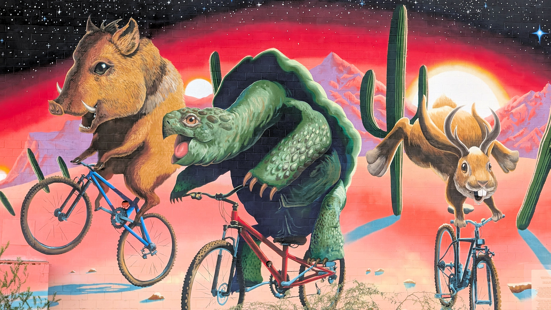 Epic Ride Murales von Joe Pagnac mit drei Tieren auf Fahrrädern
